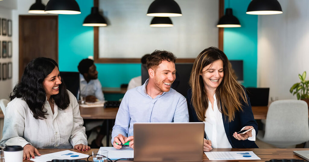 employees working together in an office space.