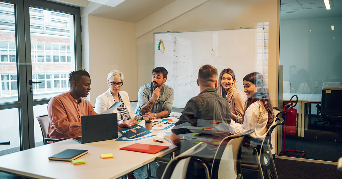 team working together in a conference room.