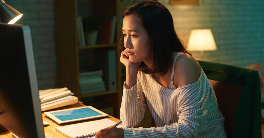 women working from home using her computer